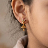 Ruby CZ Stone Small Kids Jhumka earrings featuring a gold floral stud and miniature jhumka bell.