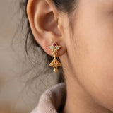 Ruby CZ Stone Small Kids Jhumka earrings featuring a gold floral stud and miniature jhumka bell.