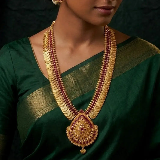Gold-Plated Stone Lakshmi Kasu Haram Necklace worn by a model in a traditional green saree.