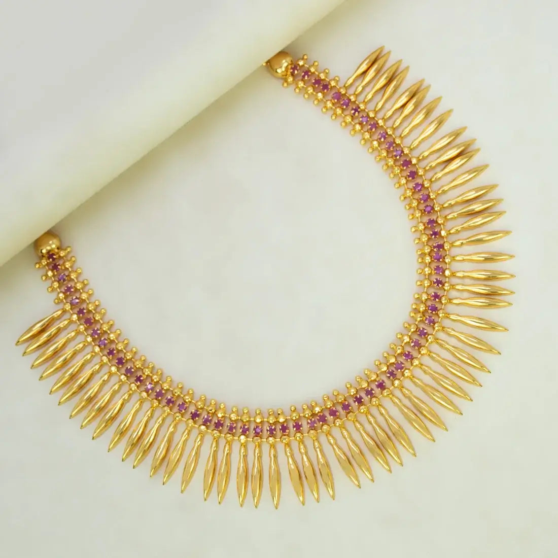 Gold Plated Jasmine Bud Ruby Stone Necklace featuring intricate gold bud designs and ruby stones.