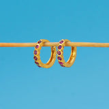 Gold Plated Stone Hoop Earrings for Women featuring purple stones set in a sleek gold finish.