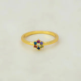 Saptaratna Floral Stone Gold Plated Ring featuring a cluster of colorful stones on a slim gold band.
