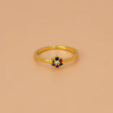 Saptaratna Floral Stone Gold Plated Ring featuring a cluster of seven vibrant stones in a gold-plated setting.
