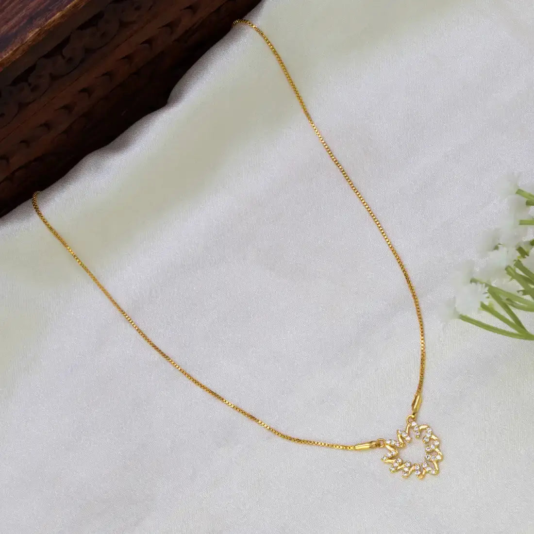 Stunning Gold-Plated CZ Pendant Chain with floral openwork pendant and cubic zirconia stones.