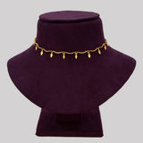 Gold Plated Wavy Chain Elakkathali Necklace displayed on a black velvet bust showcasing its elegant design.