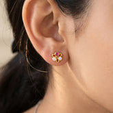 Simple Stone Flower Studs for Second Lobe & Kids worn in ear, featuring gold outline and sparkling stones.