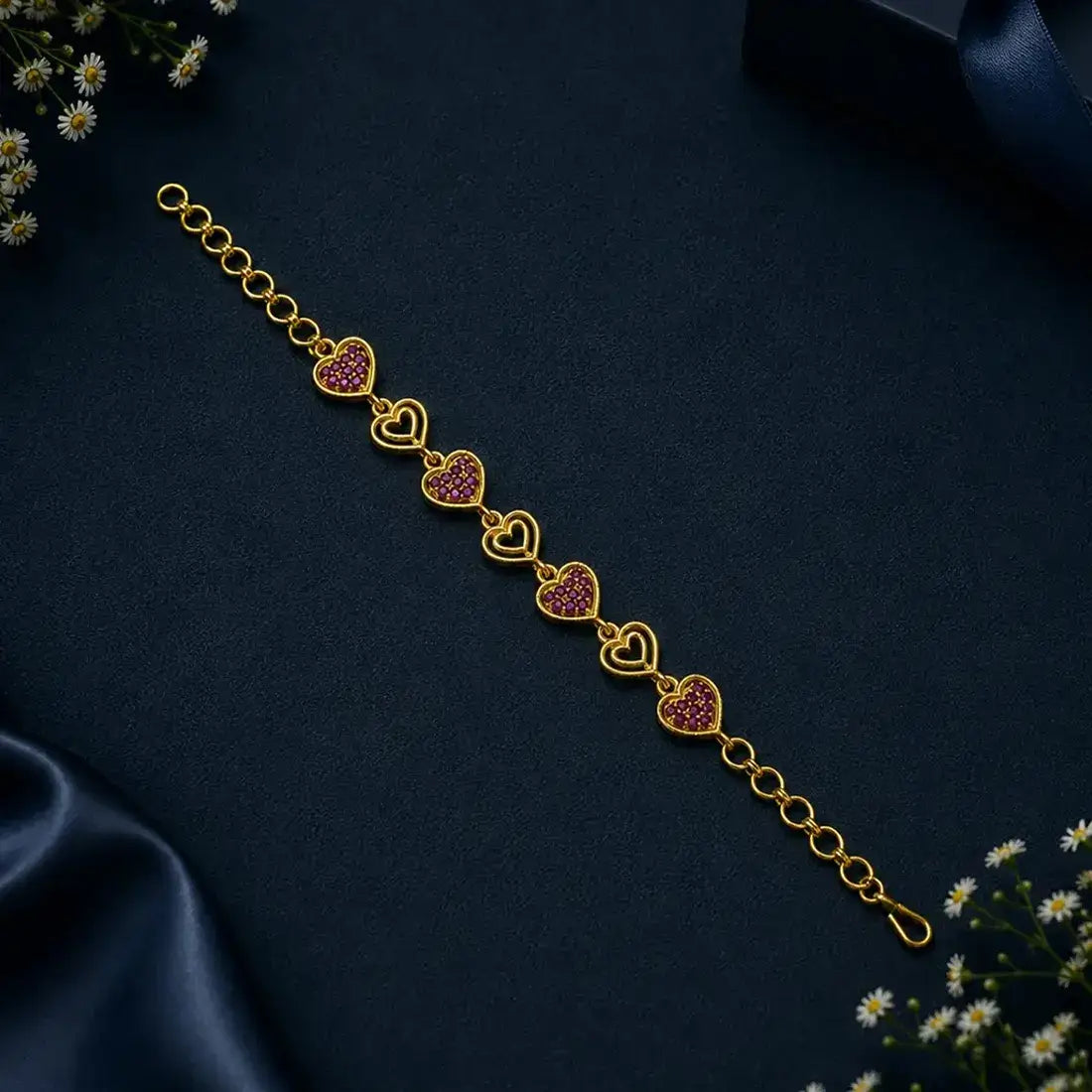Gold Plated Stones and Outline Heart Bracelet featuring alternating heart links set with sparkling stones.