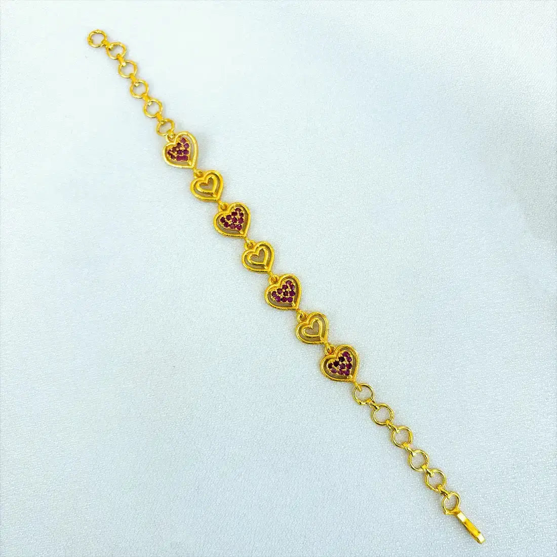 Gold Plated Stones and Outline Heart Bracelet featuring sparkling stones and open-outline heart design.