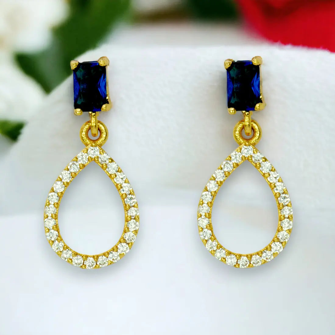 Sparkling Blue Sapphire Stone Studs CZ Drop Earrings showcasing elegant teardrop design with dazzling stones.