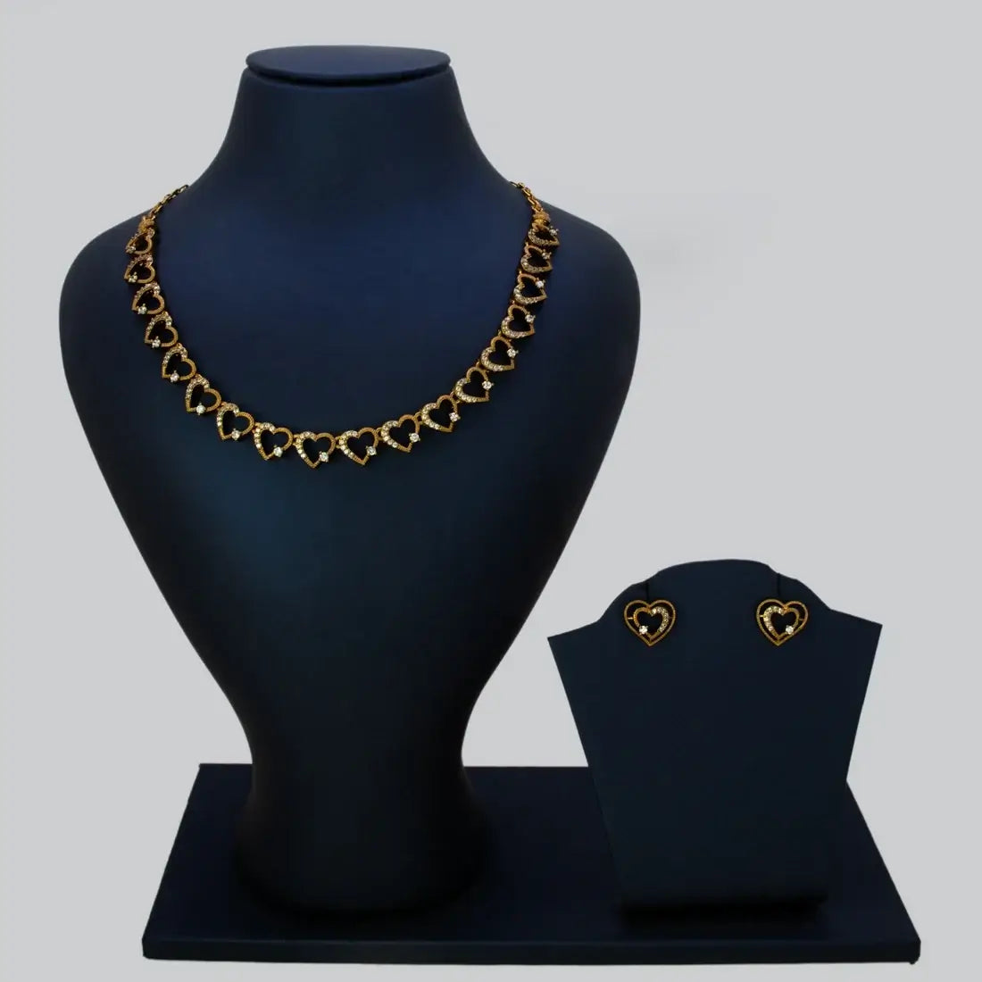 Victorian Antique Gold Stone Heart Necklace Set displayed on a black bust with matching earrings.