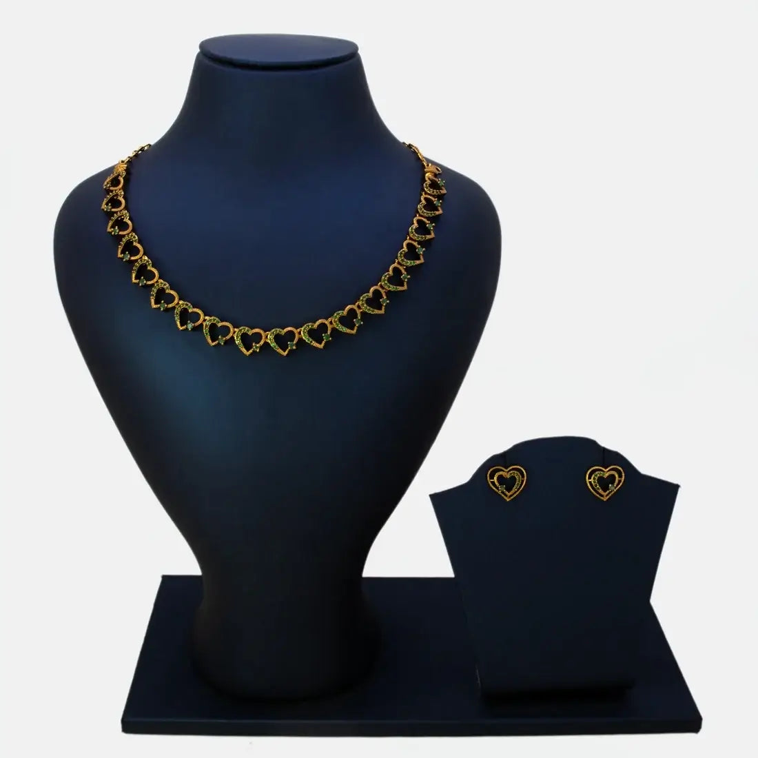 Victorian Antique Gold Stone Heart Necklace Set displayed on a black jewelry stand with matching earrings.