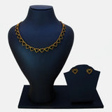 Victorian Antique Gold Stone Heart Necklace Set displayed on a black jewelry stand with matching earrings.
