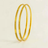 Stylish Gold Plated Designer Cutting Bangles elegantly displayed, perfect for daily wear and special occasions.