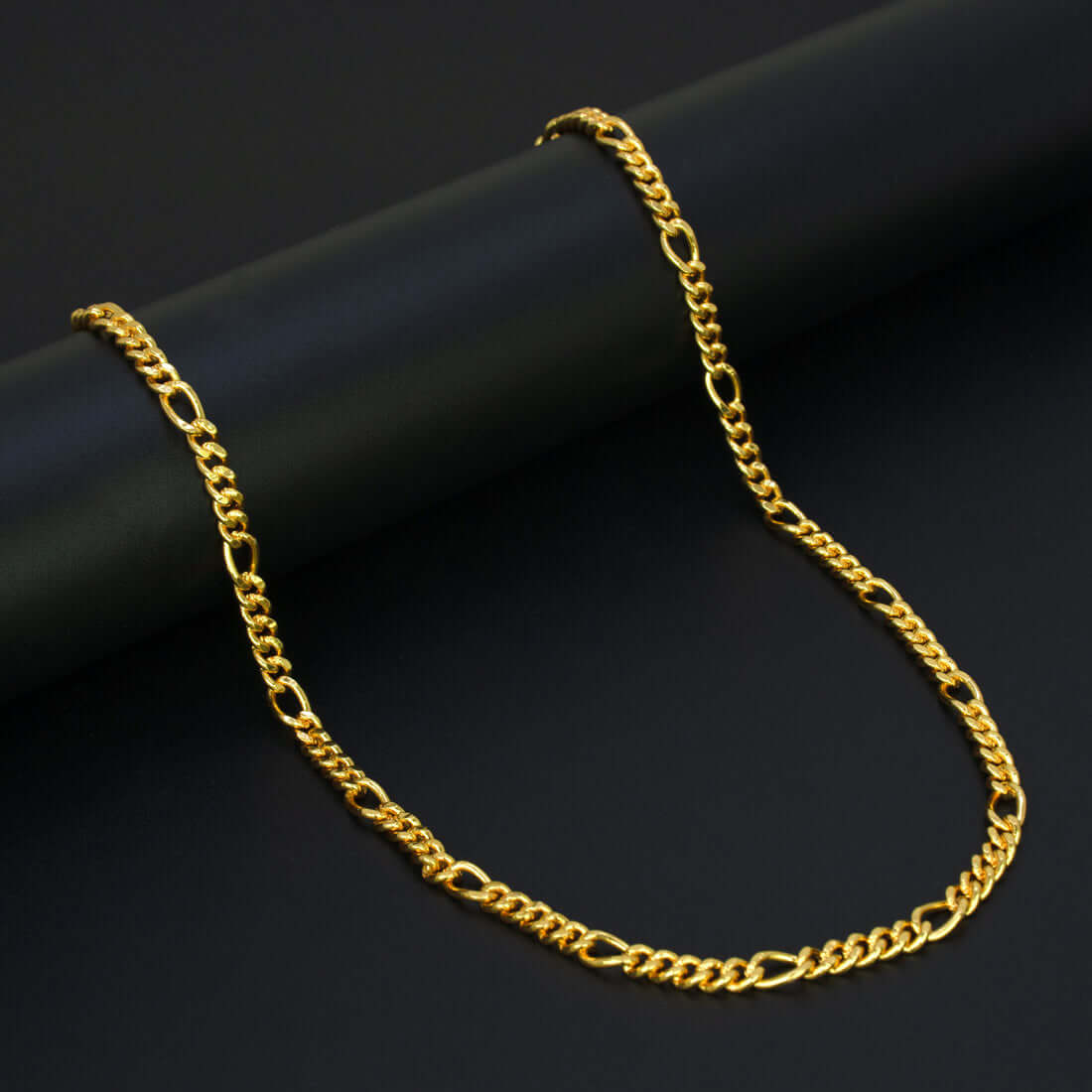 Unisex Gold Plated Figaro Sachin Chain elegantly displayed against a dark background.