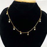 Gold-plated necklace with small White pendants