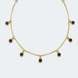 Gold-plated necklace with small black stone pendants