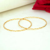Delicate Gold Plated Wave Pattern Bangles displayed on a neutral background, showcasing their elegant design.