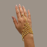 Designer Gold Plated White CZ Stone Finger Ring Set showcased on a hand with intricate floral bracelet.