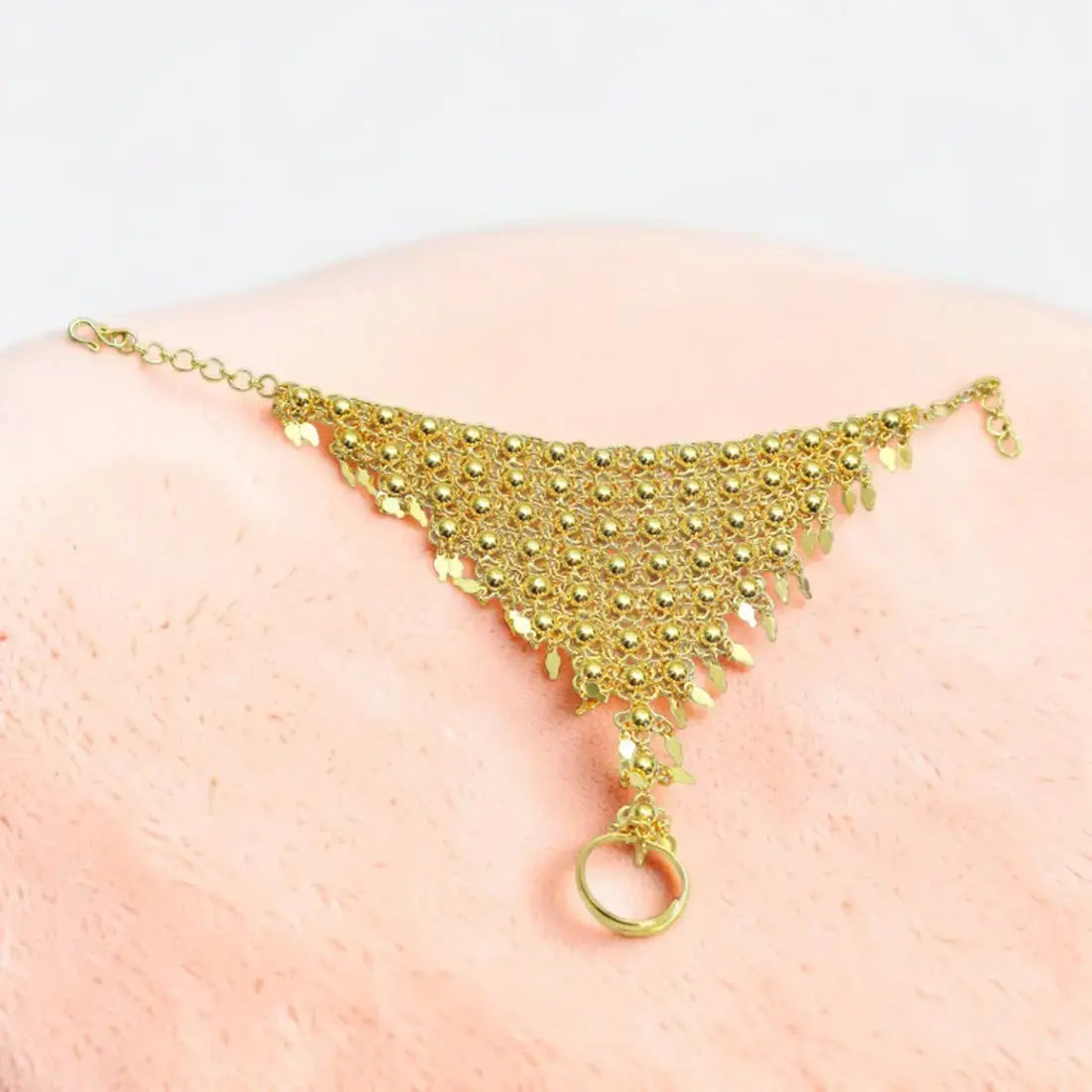 Classic Gold-Plated Bridal Finger Ring Set beautifully complemented by an intricately crafted beaded design bracelet.