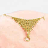 Classic Gold-Plated Bridal Finger Ring Set beautifully complemented by an intricately crafted beaded design bracelet.