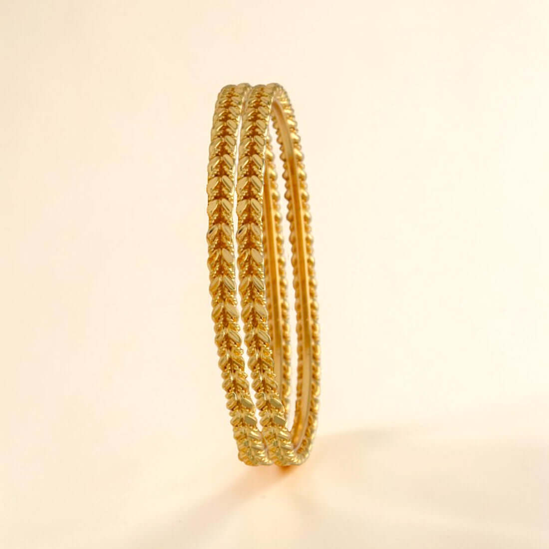 Gold Plated Leaf and Spiral Design Bangles elegantly showcasing a spiral pattern.