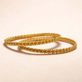 Gold Plated Leaf and Spiral Design Bangles elegantly crafted with interlocking leaf motifs.