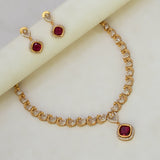 K Supreme gold-plated necklace set with ruby red cubic zirconia stones in a peacock design, includes matching earrings.