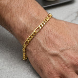K Supreme gold plated brass figaro chain bracelet for men and women, 4mm width, S hook closure, high polish finish.