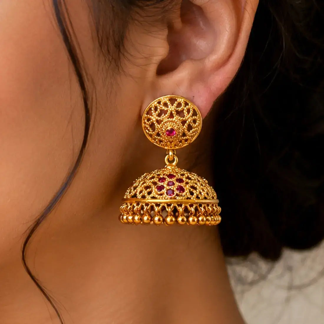 Premium Gold Plated Traditional Ruby Stones Jhumka Earrings showcasing intricate design and vibrant rubies.