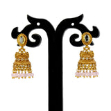 Small Antique Gold Plated Stone Jhumka For Girls featuring intricate design and dangling beads on display.
