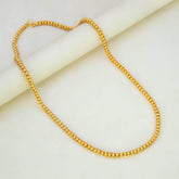 Trendy Gold Plated Designer Rail Chain elegantly displayed on a marble surface.