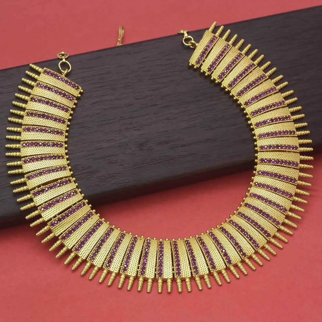 Antique Gold Plated Broad Matte Finish Ruby Necklace showcasing intricate design and elegant craftsmanship.