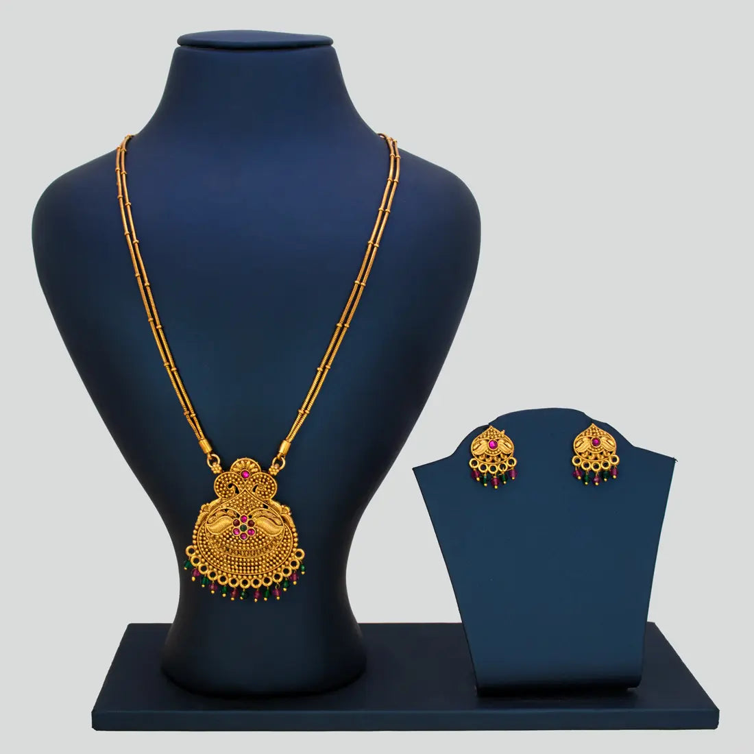 Antique 2-Strand Kemp Stone Pendant Necklace Set displayed on a stand with matching earrings in antique gold finish.