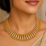 Antique Gold Plated Broad Matte Finish Ruby Necklace showcased on a woman, highlighting intricate craftsmanship and vibrant rubies.