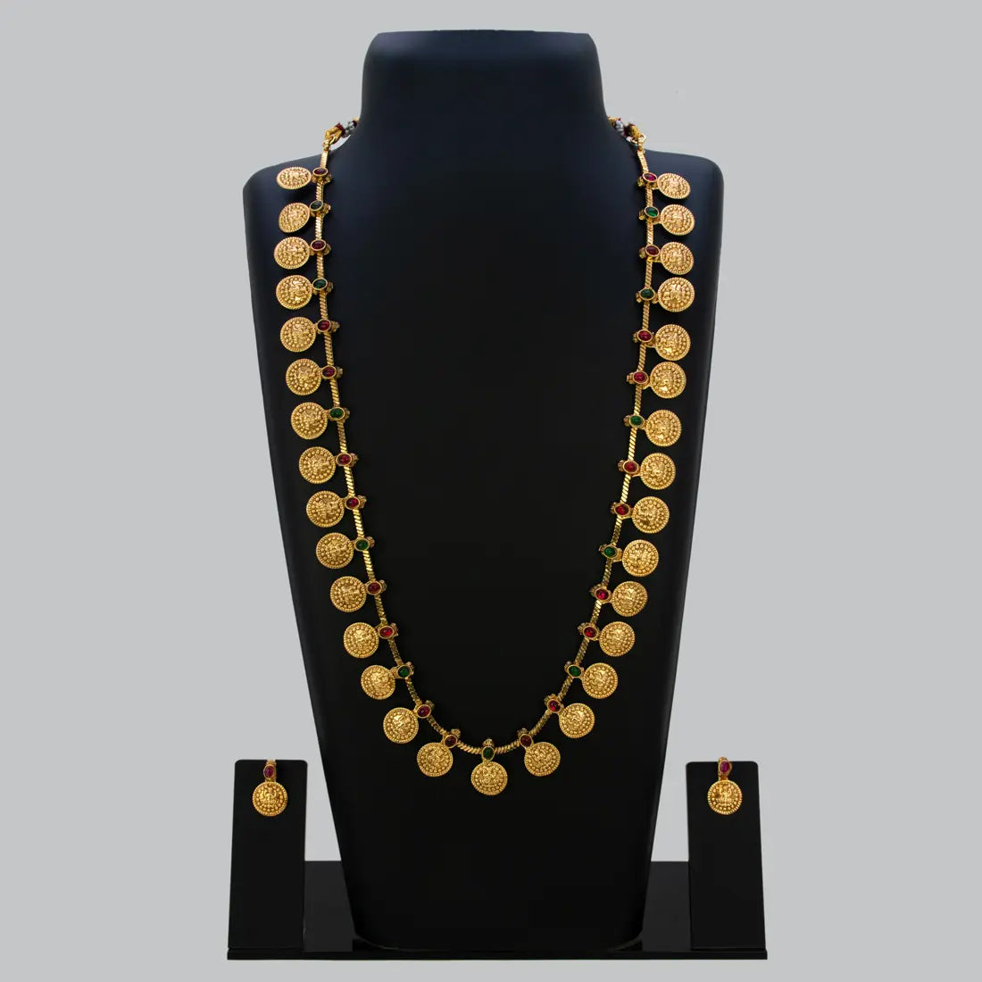 Traditional Antique Lakshmi Kasu Kemp Long Chain Set displayed on a black bust showcasing intricate gold coins and Kemp stones.