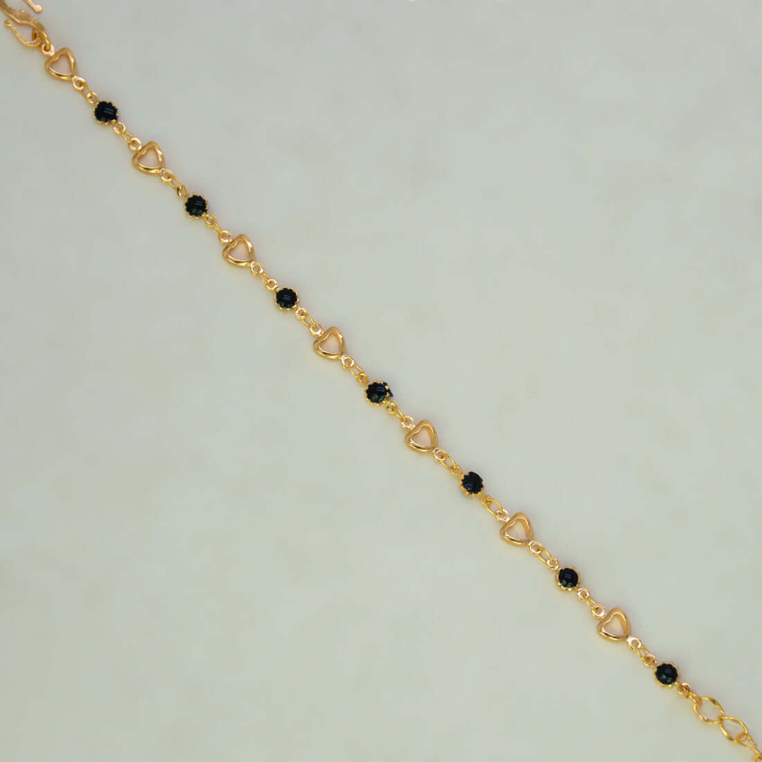 Dainty Black Enamel Flower & Golden Heart Bracelet