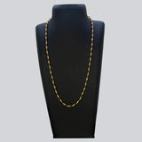 Gold Plated Black and White Pearl Chain Necklace for Women displayed on a black jewelry stand.