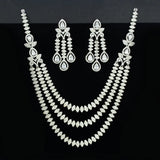 American Diamond necklace and earrings set on a black background