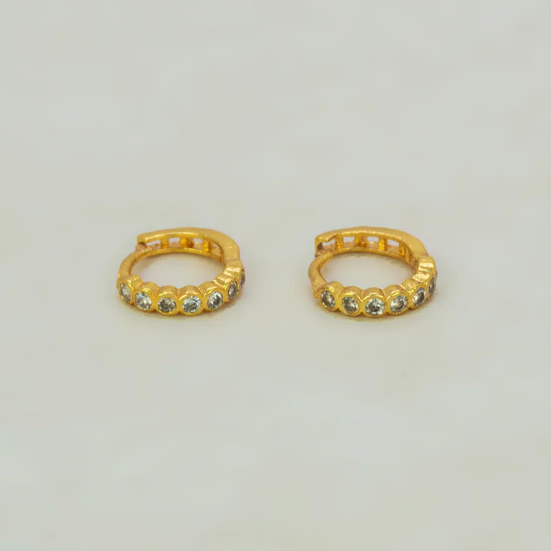 Gold Plated Stone Hoop Earrings for Women featuring cubic zirconia stones in a sleek gold finish.