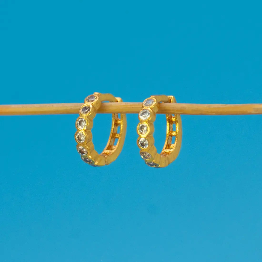 Gold Plated Stone Hoop Earrings for Women with brilliant cubic zirconia stones in a sleek gold finish.