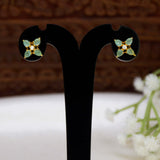 Gold-Plated Mint Green Flower CZ Ear Studs displayed on a black earring stand with floral design.