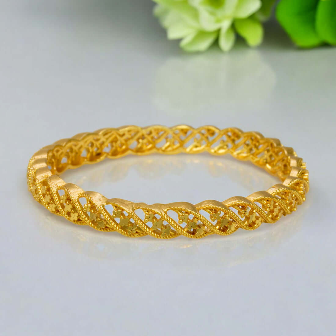 Plain Gold Plated Designer Bangle showcasing intricate twisted patterns, perfect for elevating any outfit.