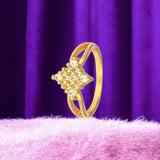 Stunning Gold Plated White CZ Stone Finger Ring on a plush backdrop with purple drapery.