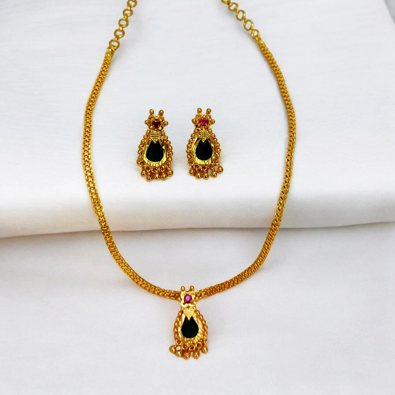 Elegant Gold Plated Green Nagapadam Pendant Set featuring a necklace and matching earrings.
