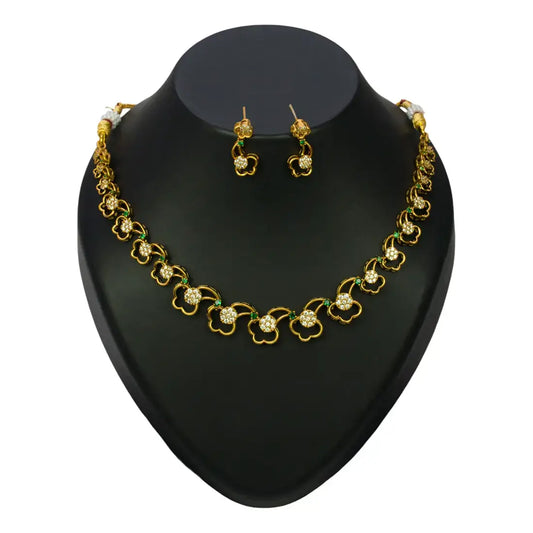 Antique Gold Plated CZ Emerald Floral Necklace Set displayed with matching earrings on a black bust.