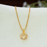 A gold box chain with a Gold-Plated CZ Heart Pendant Charm adorned with small clear stones and a central clear crystal, displayed on a white jewelry bust.