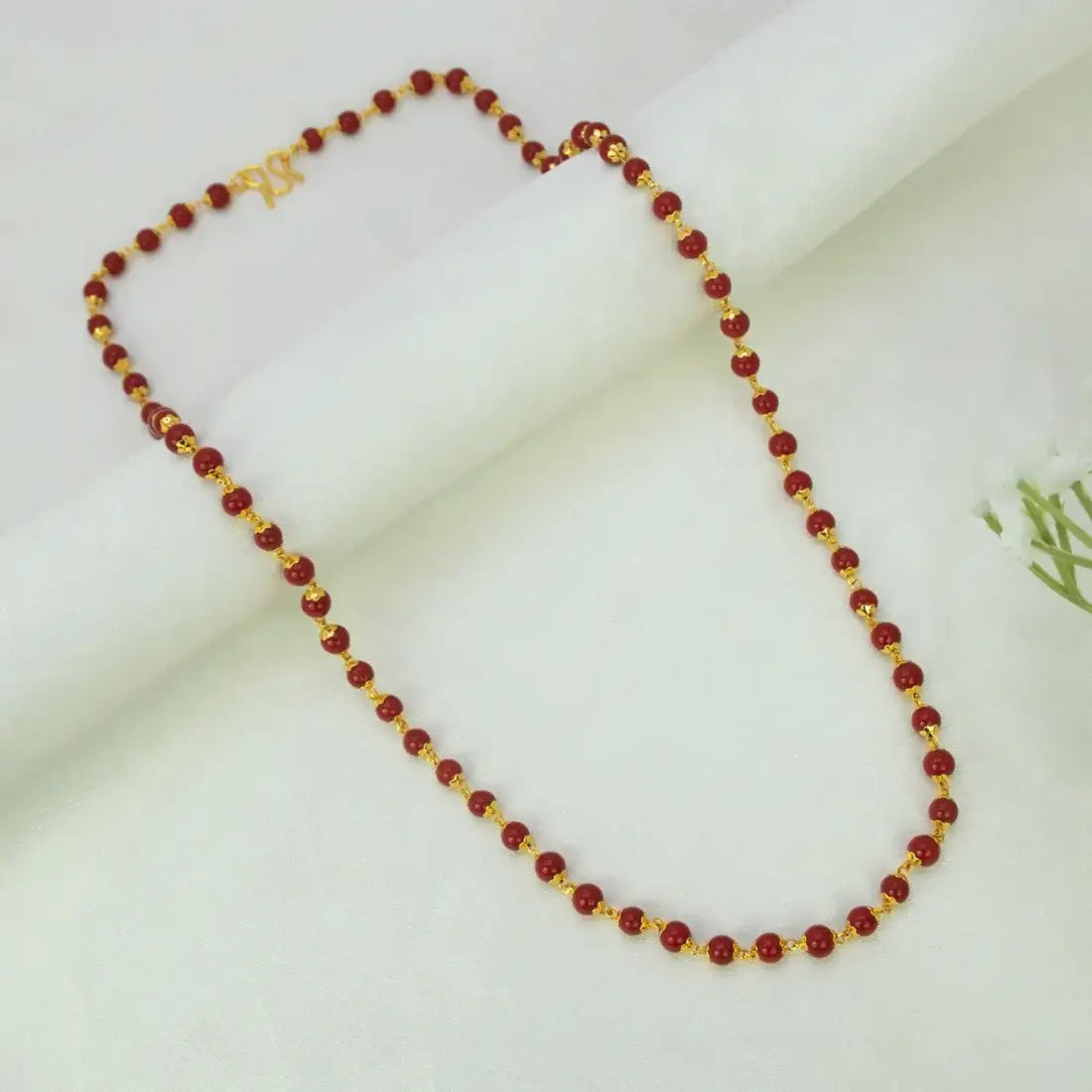 Kollam Supreme gold-plated coral red bead chain for women with round red beads and gold spacer beads