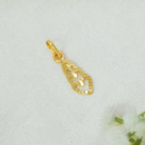 A Gold-Plated Vertical Triple Heart Pendant Charm with a textured, leaf-like cutout design and a heart motif in the center, resting on a textured white fabric background.