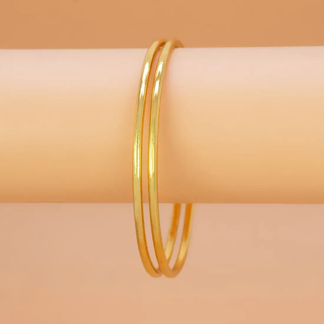 Gold-Plated Daily Wear Plain Bangles stacked elegantly, showcasing a slim and polished design for versatility and style.