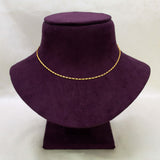 A Gold Plated Thin Titanic Chain for Kids displayed on a purple velvet jewelry bust against a light gray background.